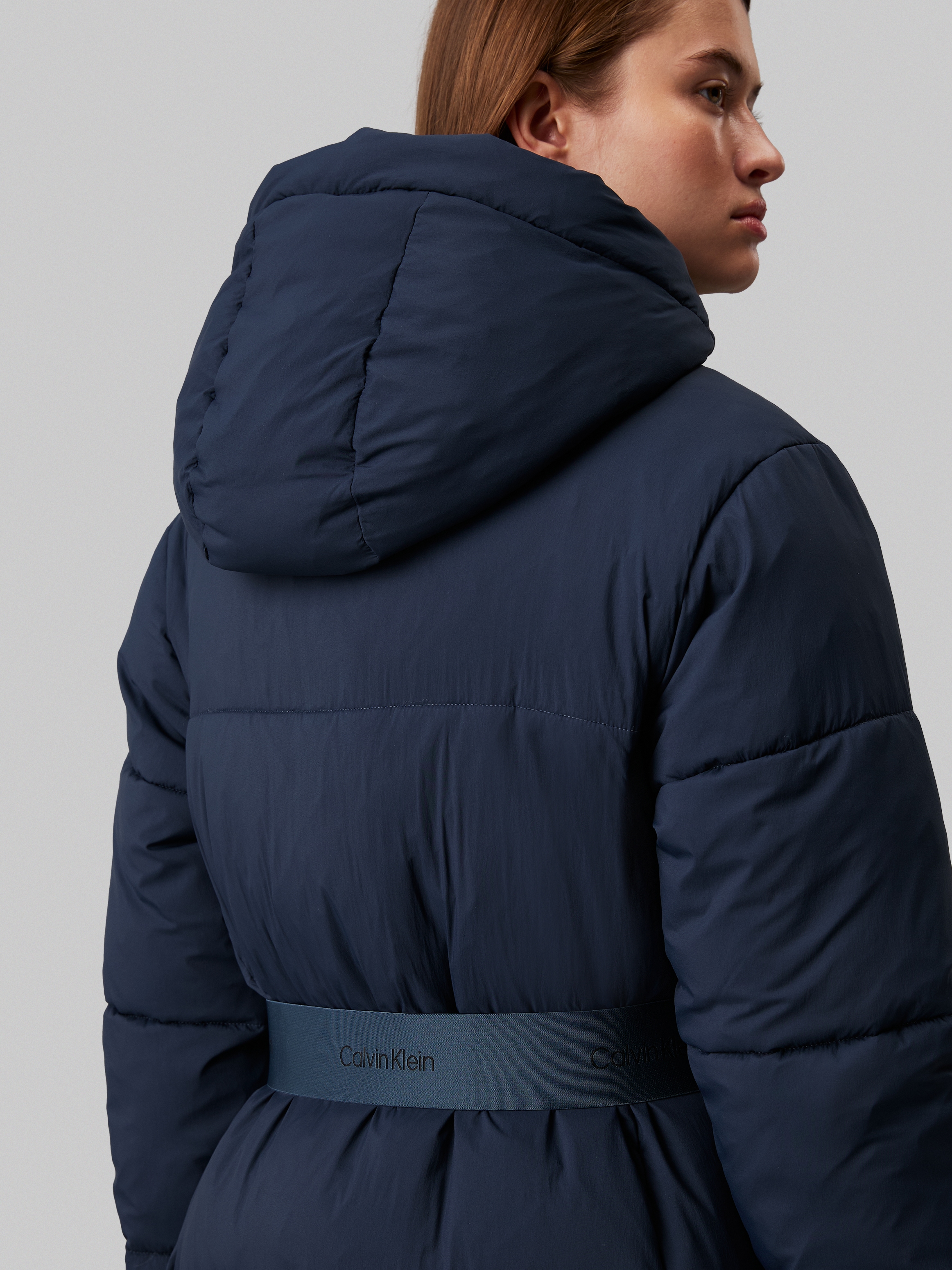 Calvin Klein Jeans Steppjacke »LOGO BELT LONG PUFFER«, mit Kapuze, mit Gürtel