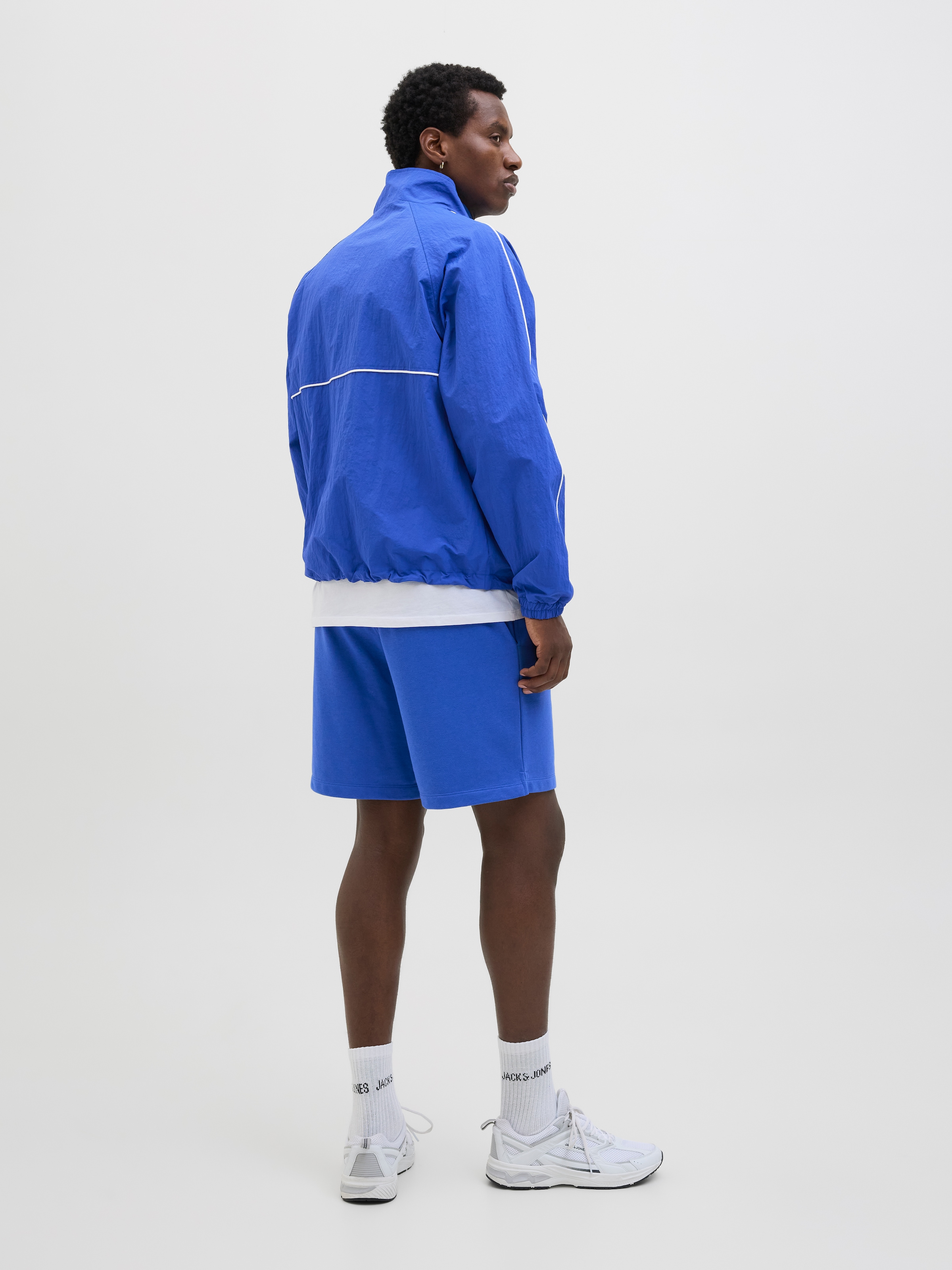 Jack & Jones Outdoorjacke »JCOUNION TRACK JACKET SN«, ohne Kapuze, Mit stylischem Print