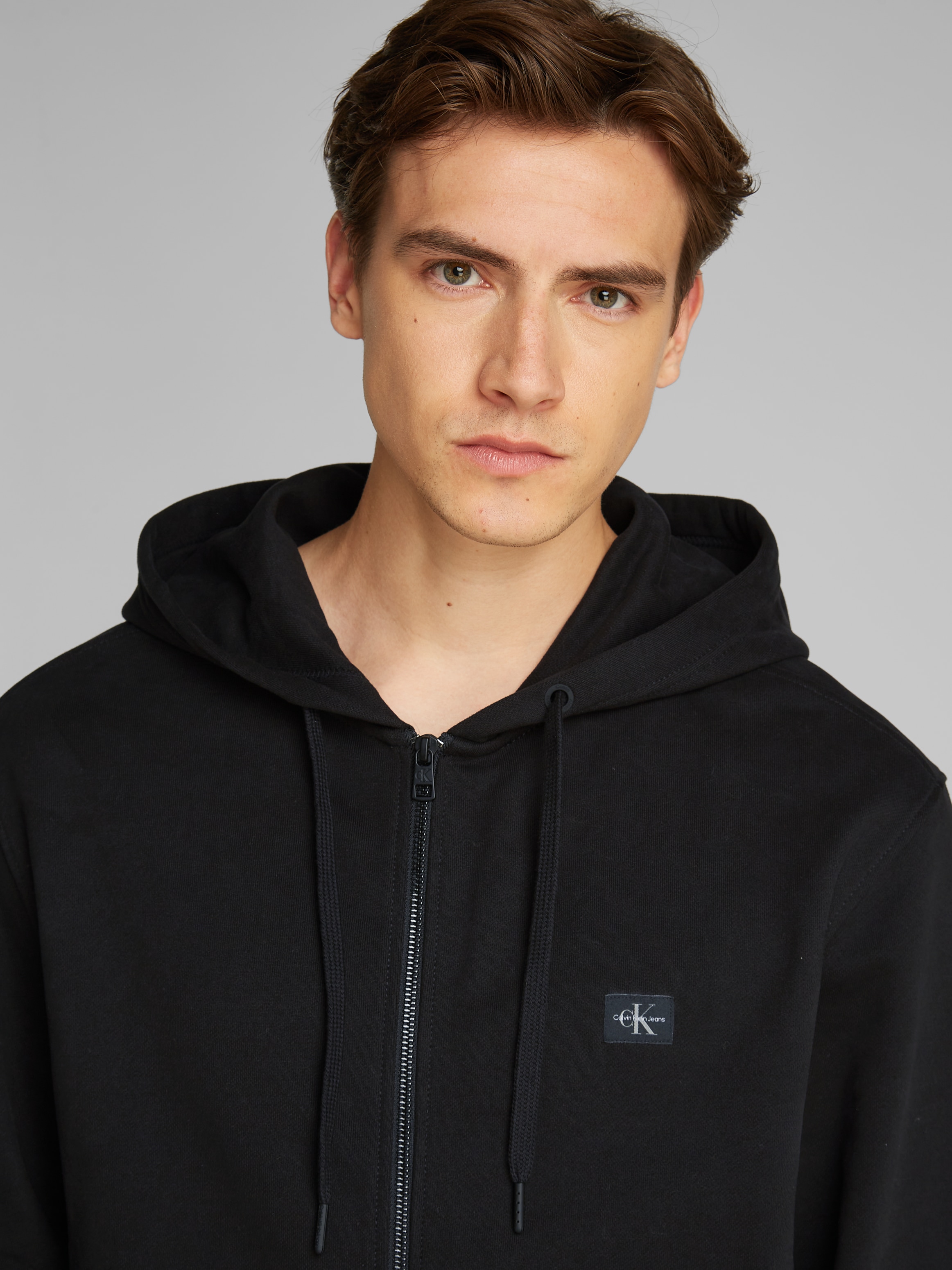 Calvin Klein Jeans Sweatjacke »WOVEN LABEL ZIP THROUGH HOODIE«, mit Logopatch