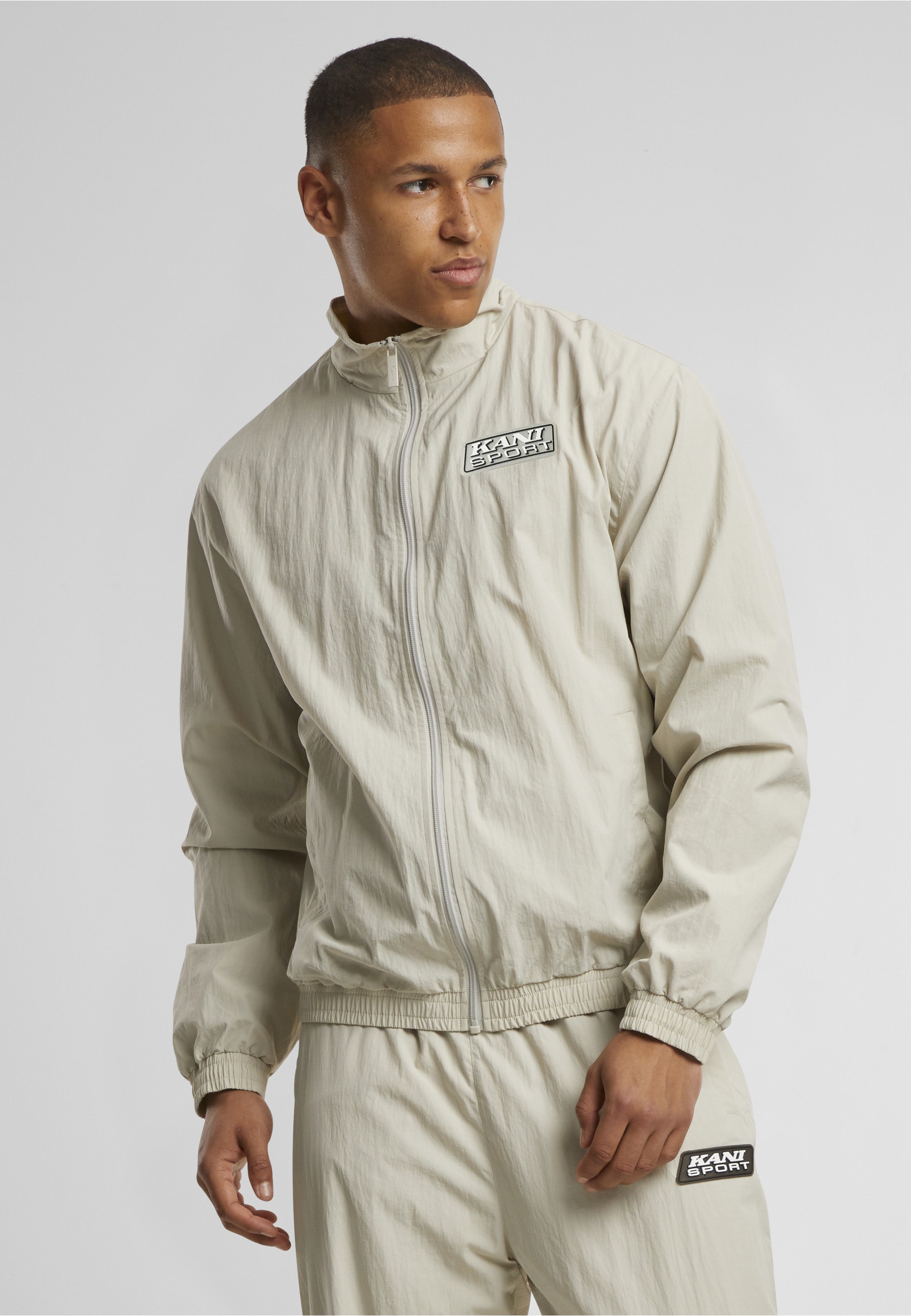 Karl Kani Trainingsjacke »Karl Kani Sport Patch Essential Trackjacket« 1 Stk. tlg. ohne Kapuze