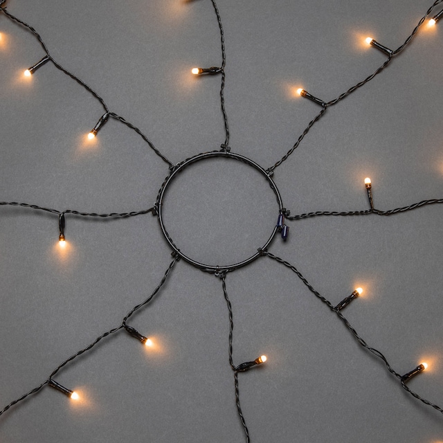 KONSTSMIDE LED-Baummantel »Weihnachtsdeko aussen, Christbaumschmuck, 8h  Timer, vormontiert«, Ring Ø 17, 8 Stränge à 70 bernsteinfarbene Dioden, mit  Glimmereffekt auf Raten bestellen