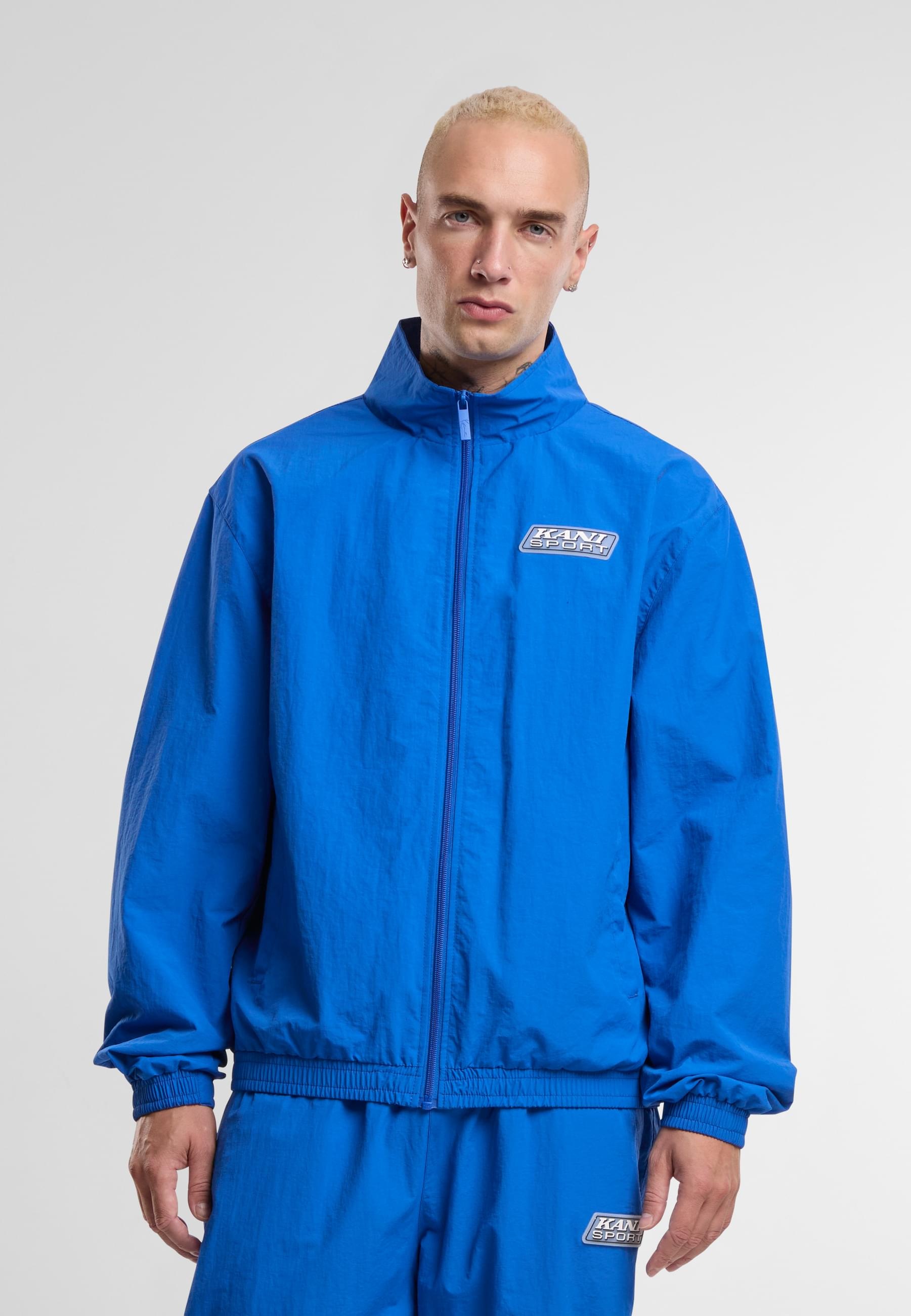 Karl Kani Trainingsjacke »Karl Kani Sport Patch Essential Trackjacket« 1 Stk. tlg. ohne Kapuze
