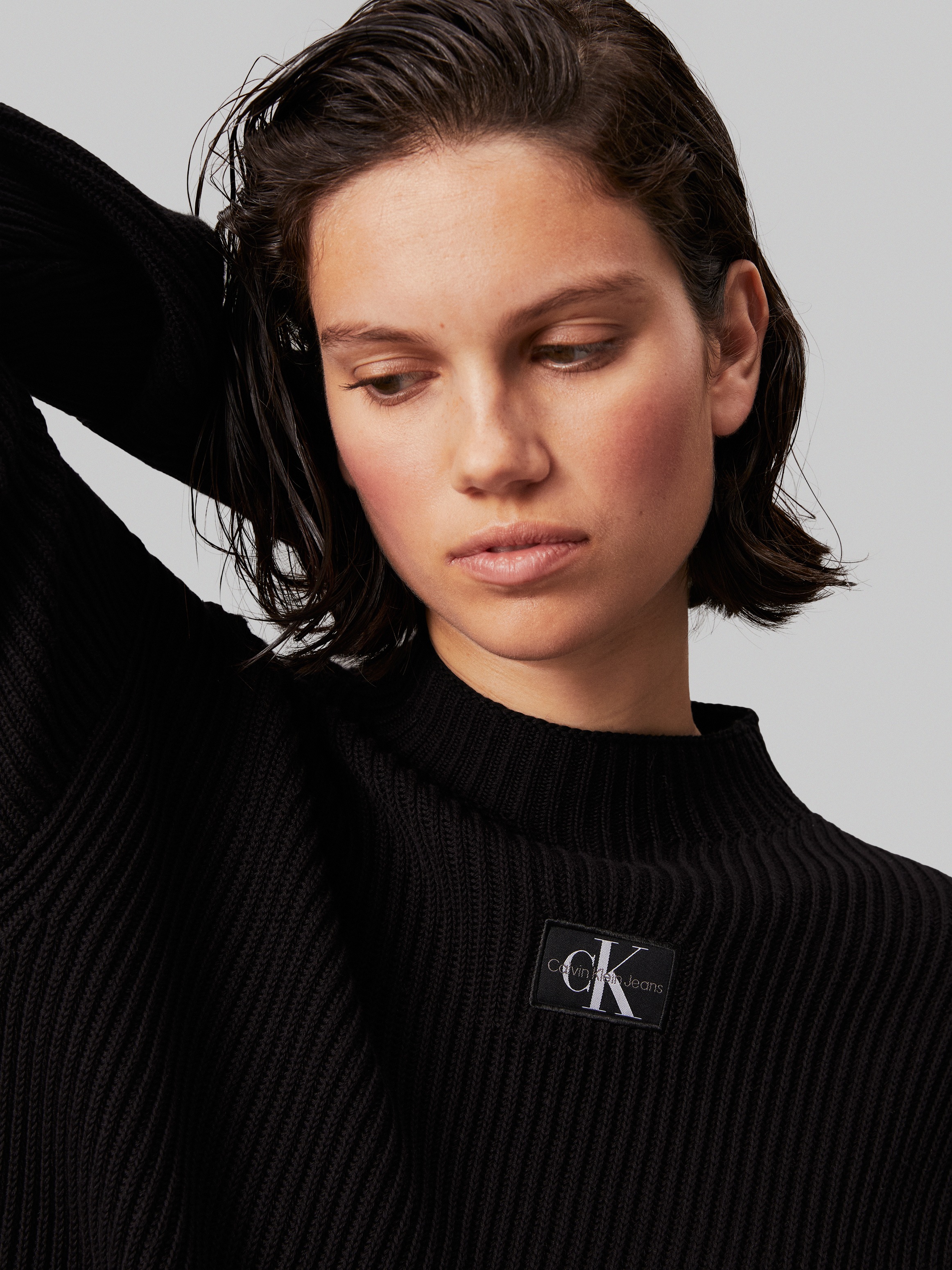 Calvin Klein Jeans Stehkragenpullover »WOVEN LABEL LOOSE SWEATER«, mit Logopatch