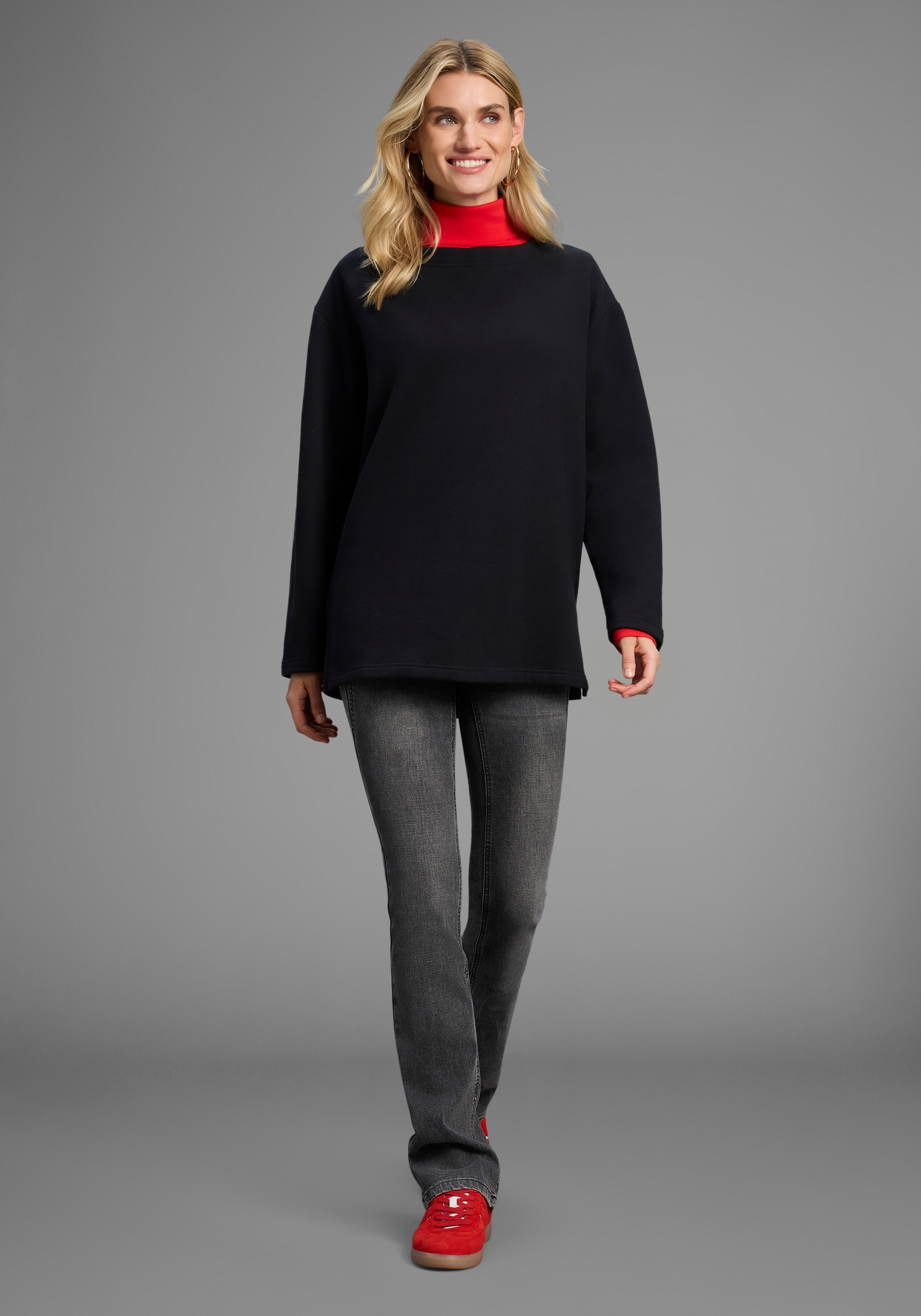 Laura Scott Sweater , Lässig-weiter Sweater mit komfortabler Passform und Seitenschlitzen.
