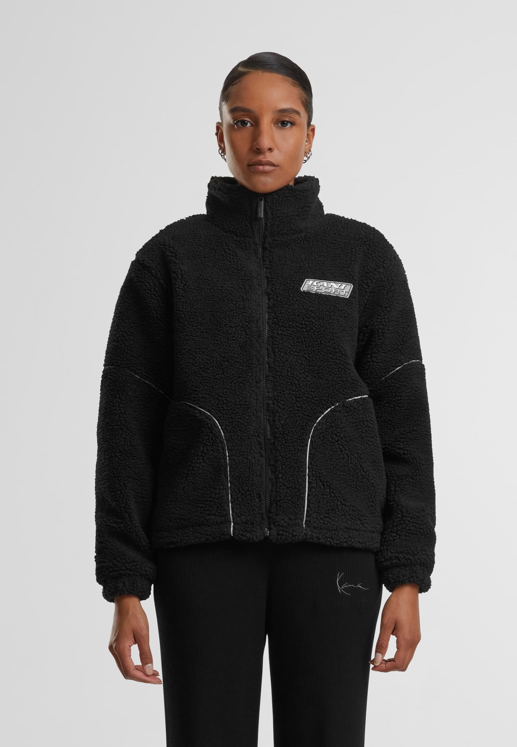 Karl Kani Trainingsjacke »Karl Kani Karl Kani Sport Patch Teddy Block Trackjacket« 1 Stk. tlg. ohne Kapuze