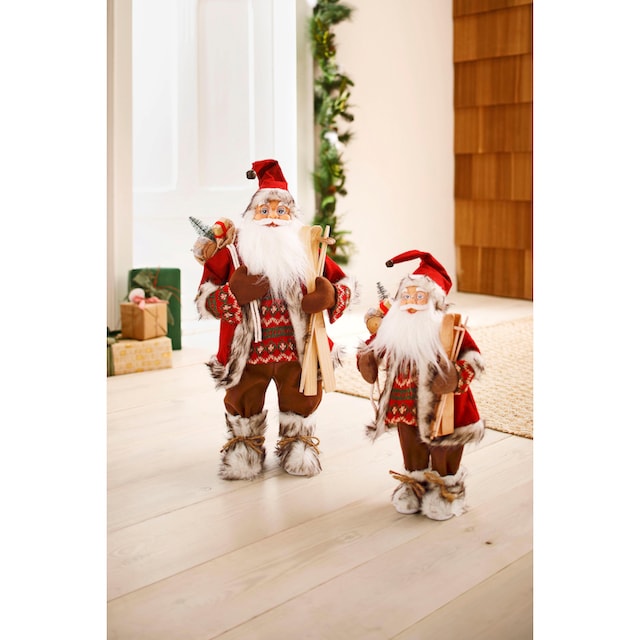 HOSSNER - HOMECOLLECTION Weihnachtsmann »Santa mit Skiern unter dem Arm und  Geschenken«, Weihnachtsdeko, Dekofigur, Weihnachtsfigur online kaufen