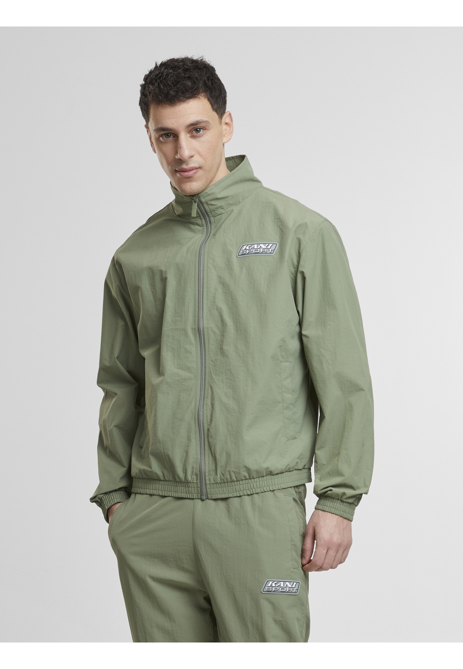 Karl Kani Trainingsjacke »Karl Kani Karl Kani Sport Patch Essential Trackjacket« 1 Stk. tlg. ohne Kapuze