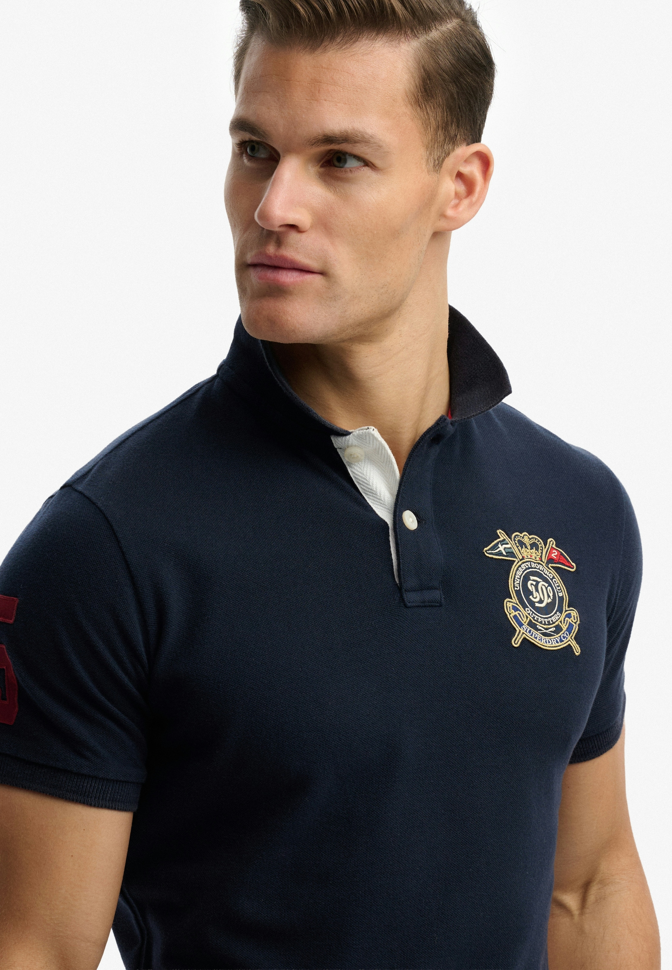 Superdry Poloshirt »CREST POLO« mit Markenlabel, aus Baumwolle, Relaxed Fit, bedruckte Optik