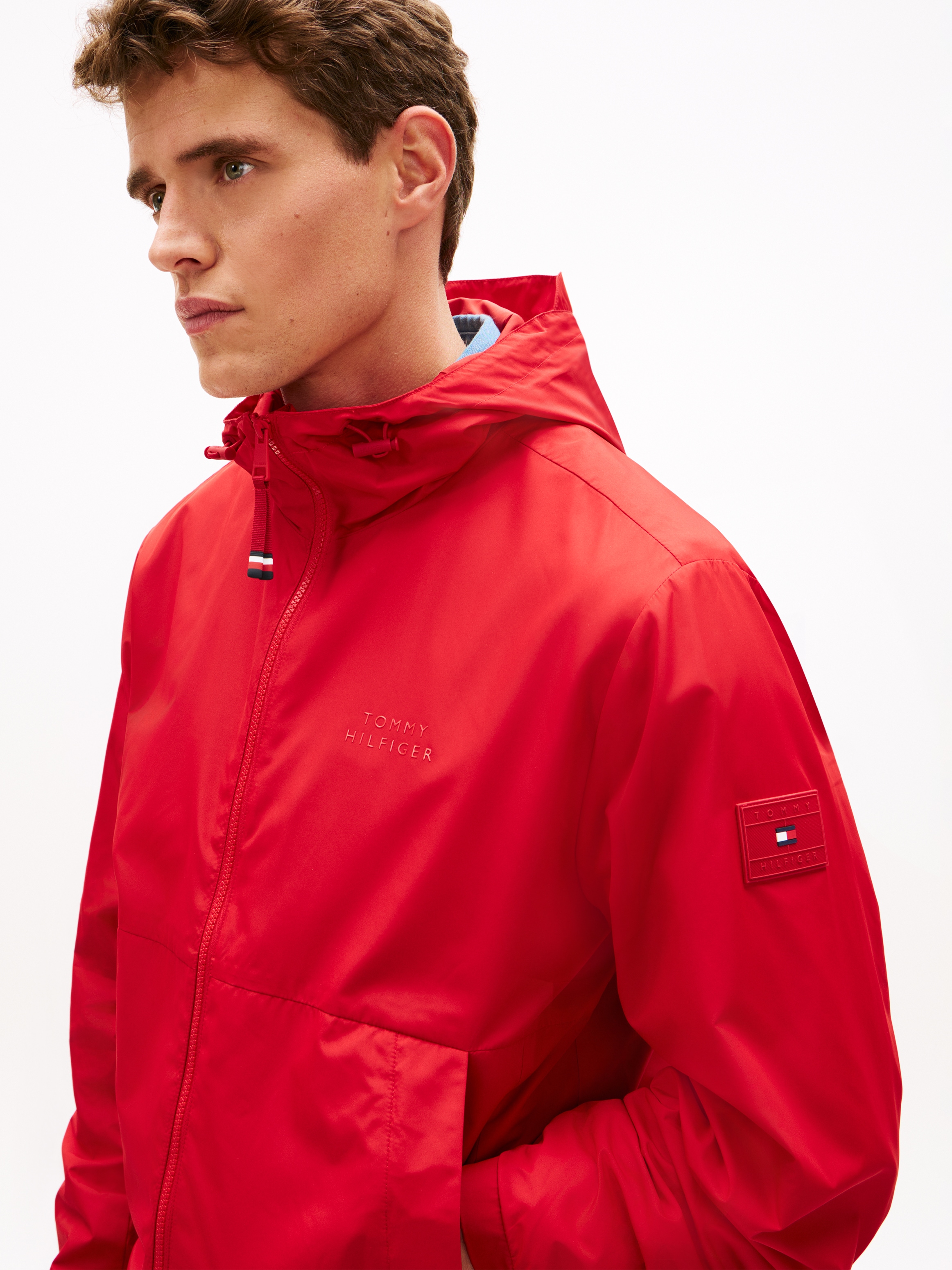 Tommy Hilfiger Allwetterjacke »BRANDED HOODED« mit Kapuze Windjacke Fahrradjacke Packable Regular fit mit Kapuze