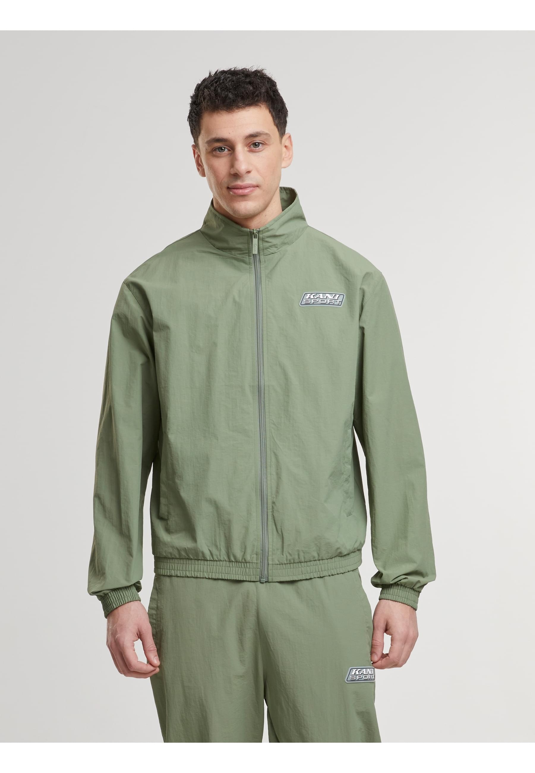 Karl Kani Trainingsjacke »Karl Kani KM-JK035-101-11 Sport Patch Essential Trackjacket« 1 Stk. tlg. ohne Kapuze