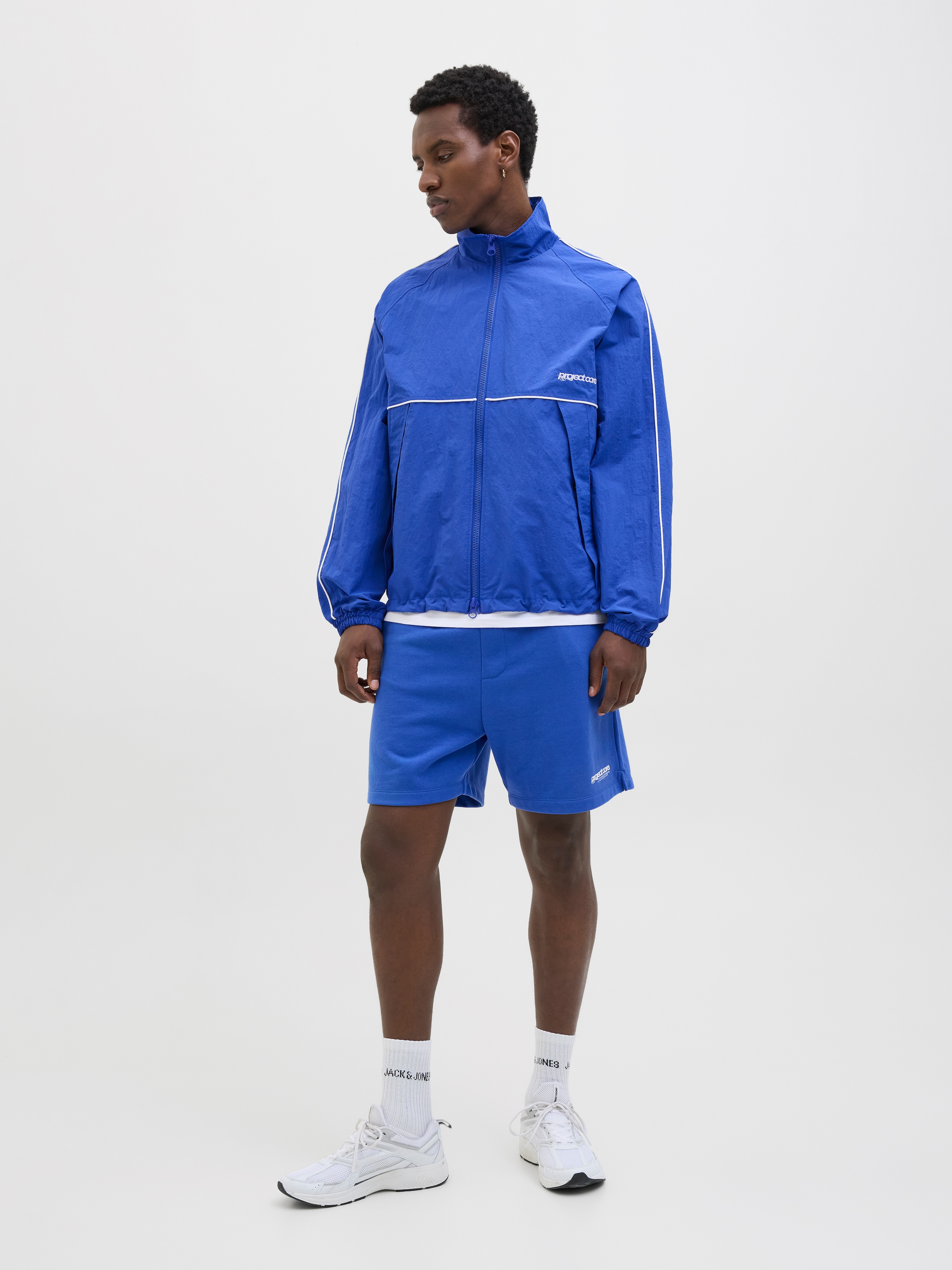 Jack & Jones Outdoorjacke »JCOUNION TRACK JACKET SN«, ohne Kapuze, Mit stylischem Print