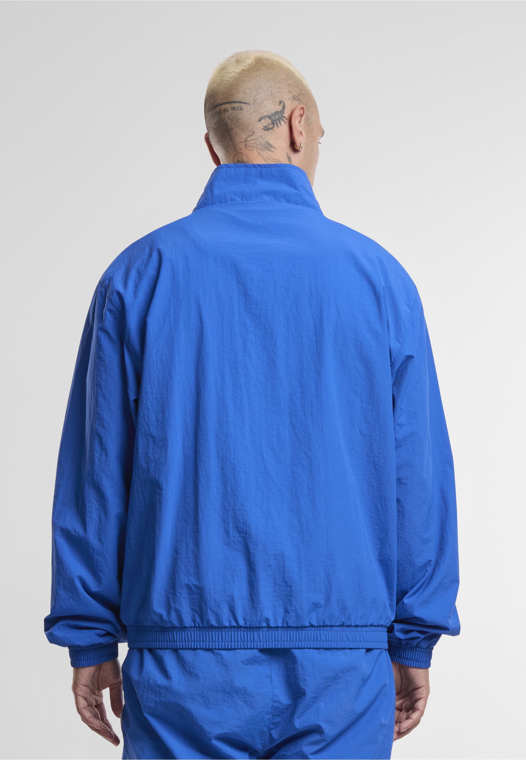 Karl Kani Trainingsjacke »Karl Kani Sport Patch Essential Trackjacket« 1 Stk. tlg. ohne Kapuze