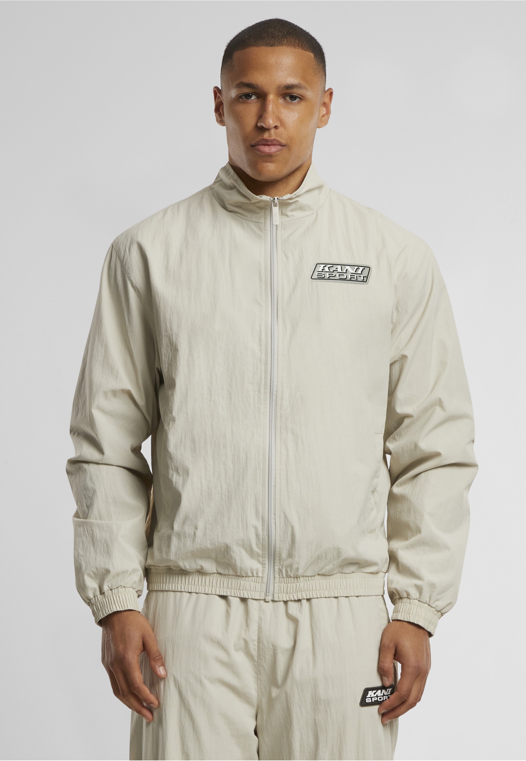Karl Kani Trainingsjacke »Karl Kani Sport Patch Essential Trackjacket« 1 Stk. tlg. ohne Kapuze