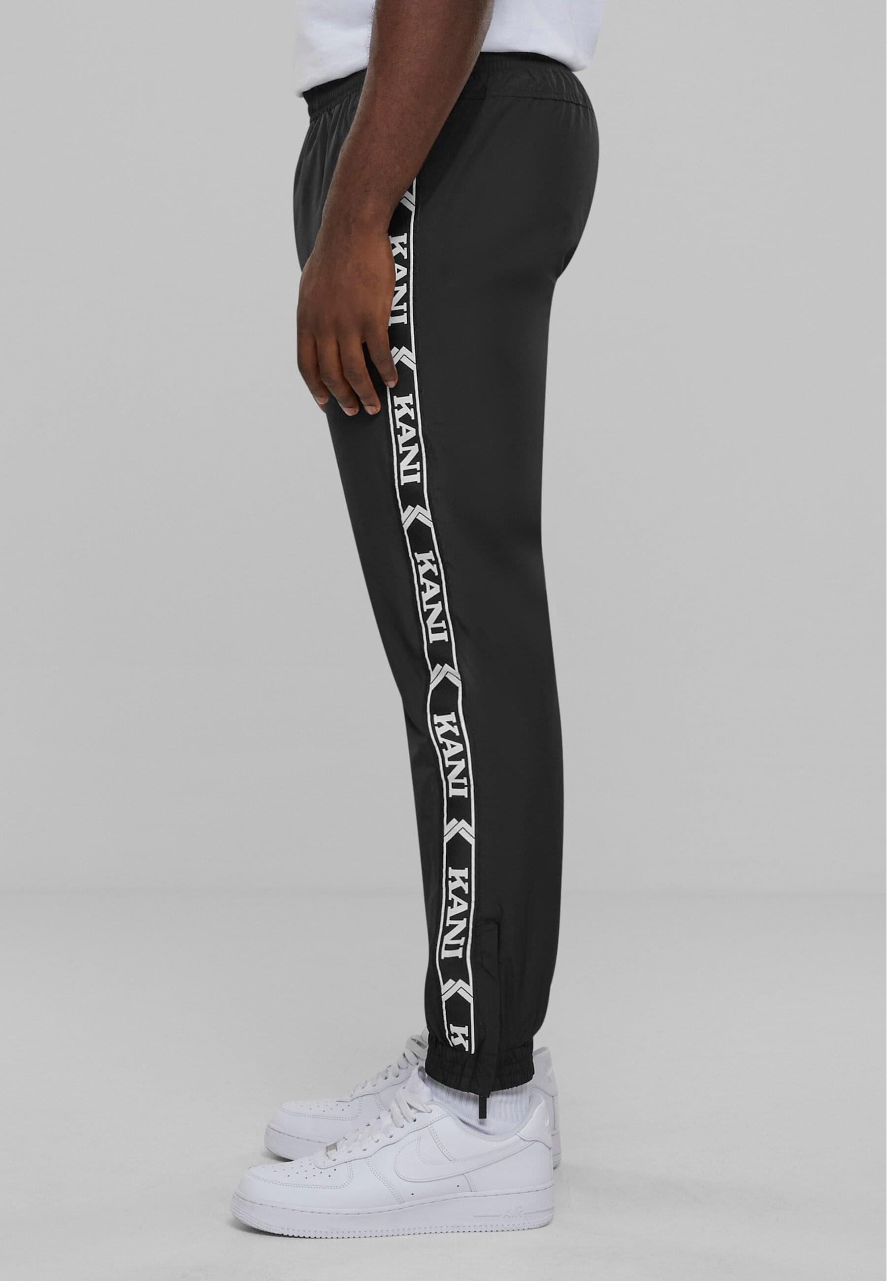Karl Kani Jogginghose »Karl Kani Herren KKMQ32025BLK KK OG Tape Trackpants«