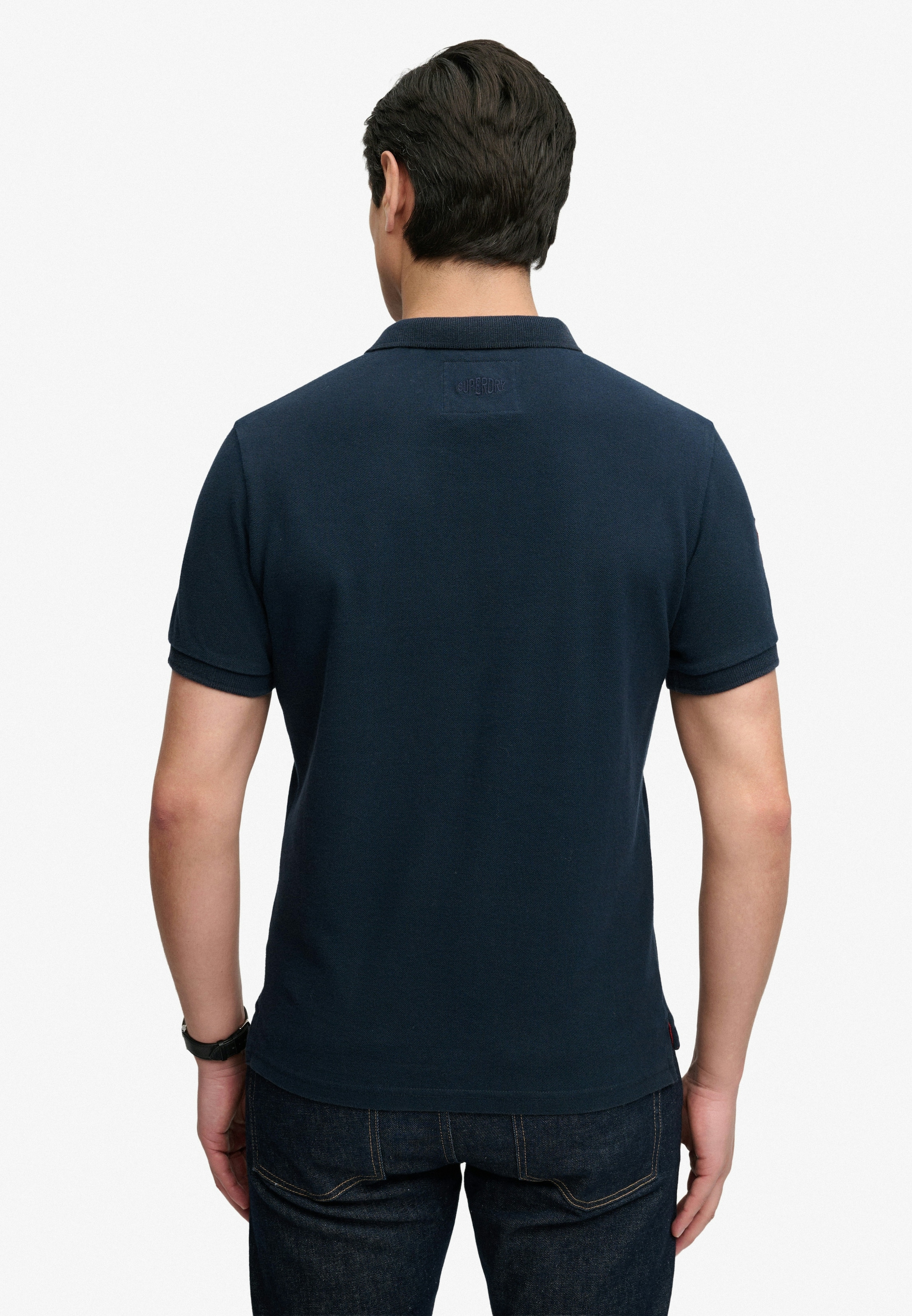 Superdry Poloshirt »CREST POLO« mit Markenlabel, aus Baumwolle, Relaxed Fit, bedruckte Optik