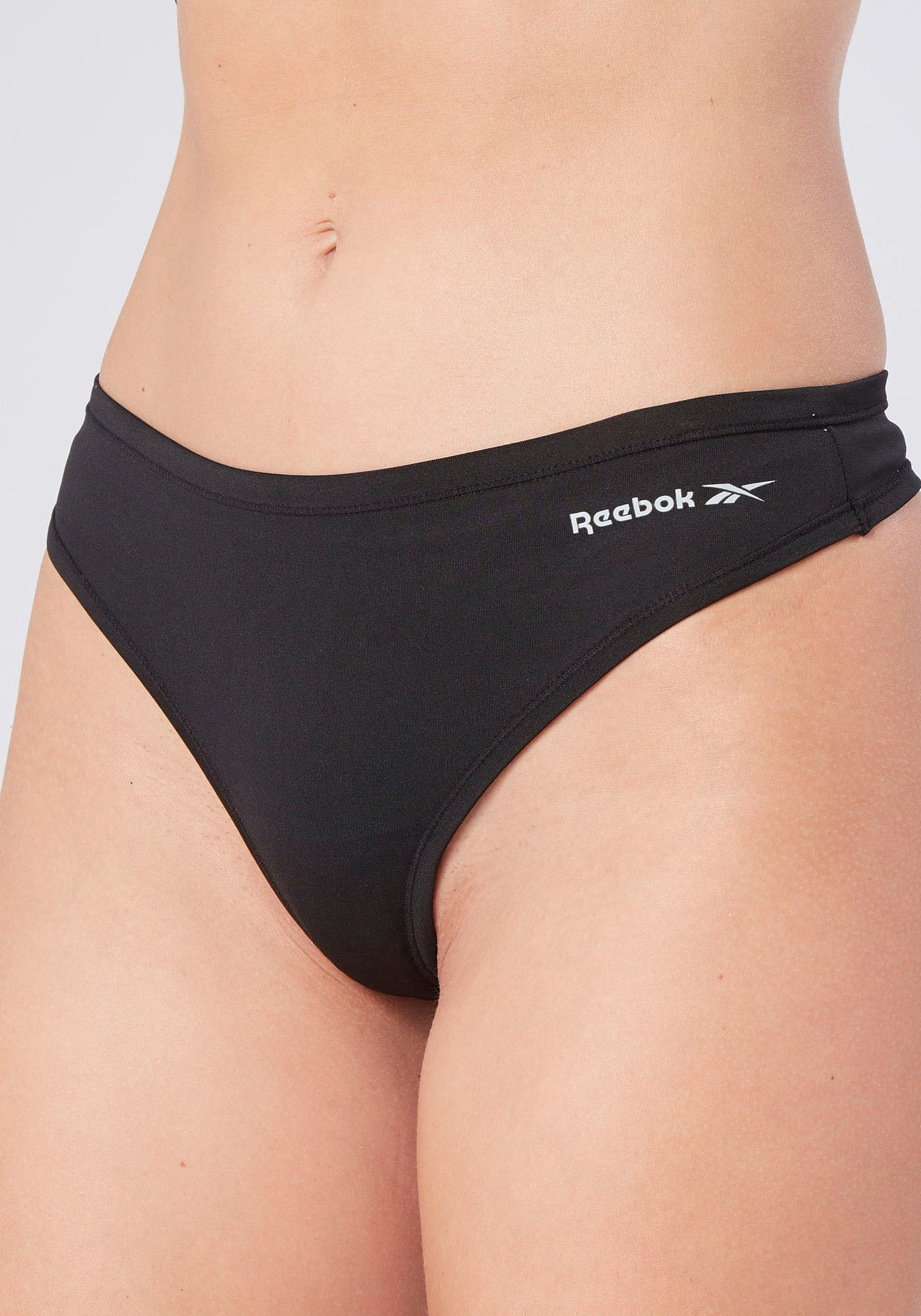 Reebok Tanga »SERENA« feuchtigkeitsregulierend, eng, basic, bequem, mit Logo