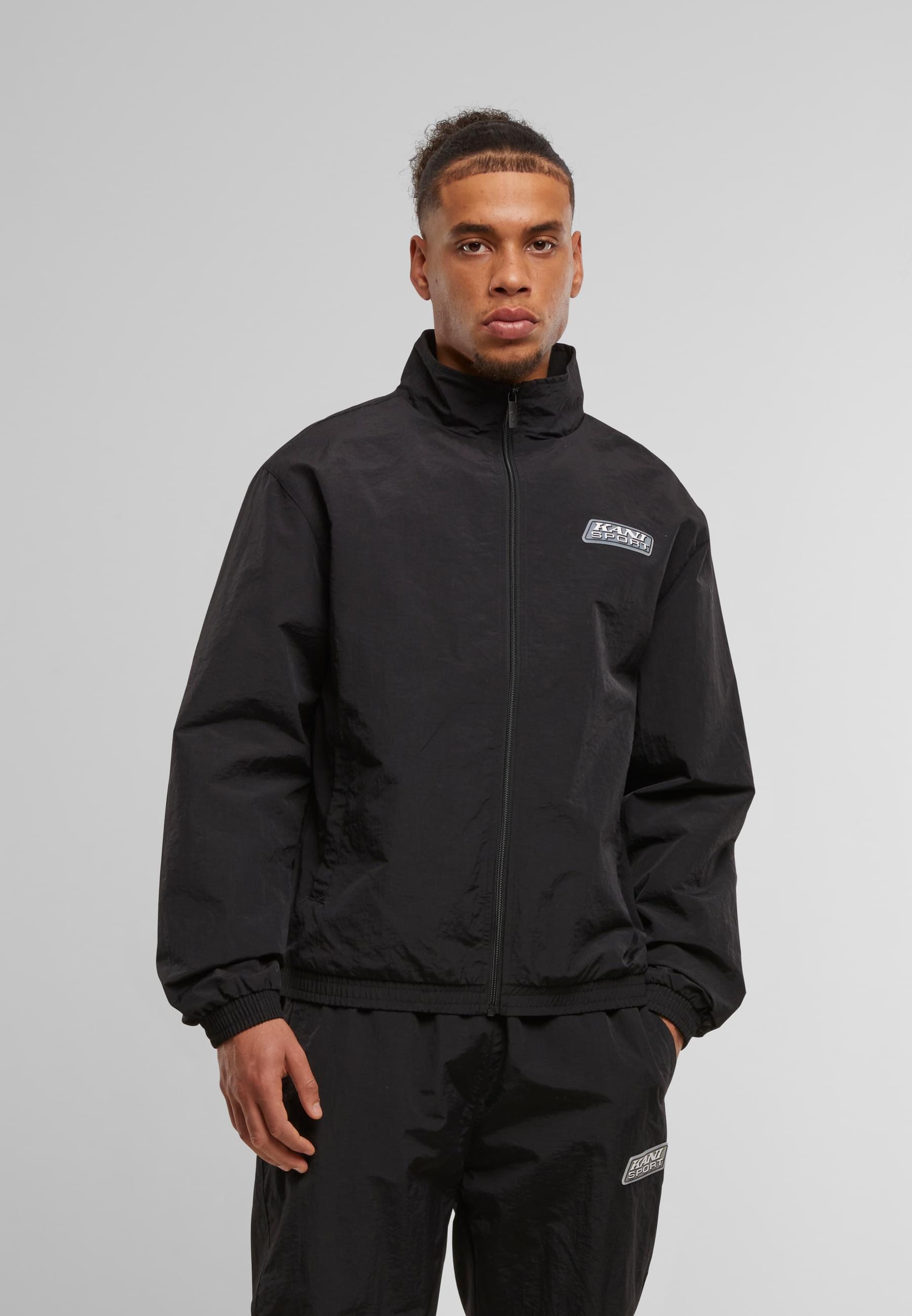 Karl Kani Trainingsjacke »Karl Kani Sport Patch Essential Trackjacket« 1 Stk. tlg. ohne Kapuze