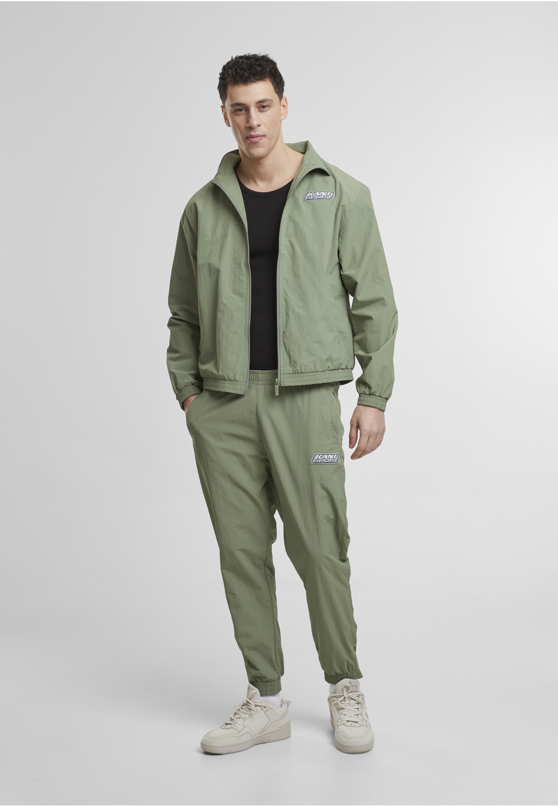 Karl Kani Trainingsjacke »Karl Kani Karl Kani Sport Patch Essential Trackjacket« 1 Stk. tlg. ohne Kapuze