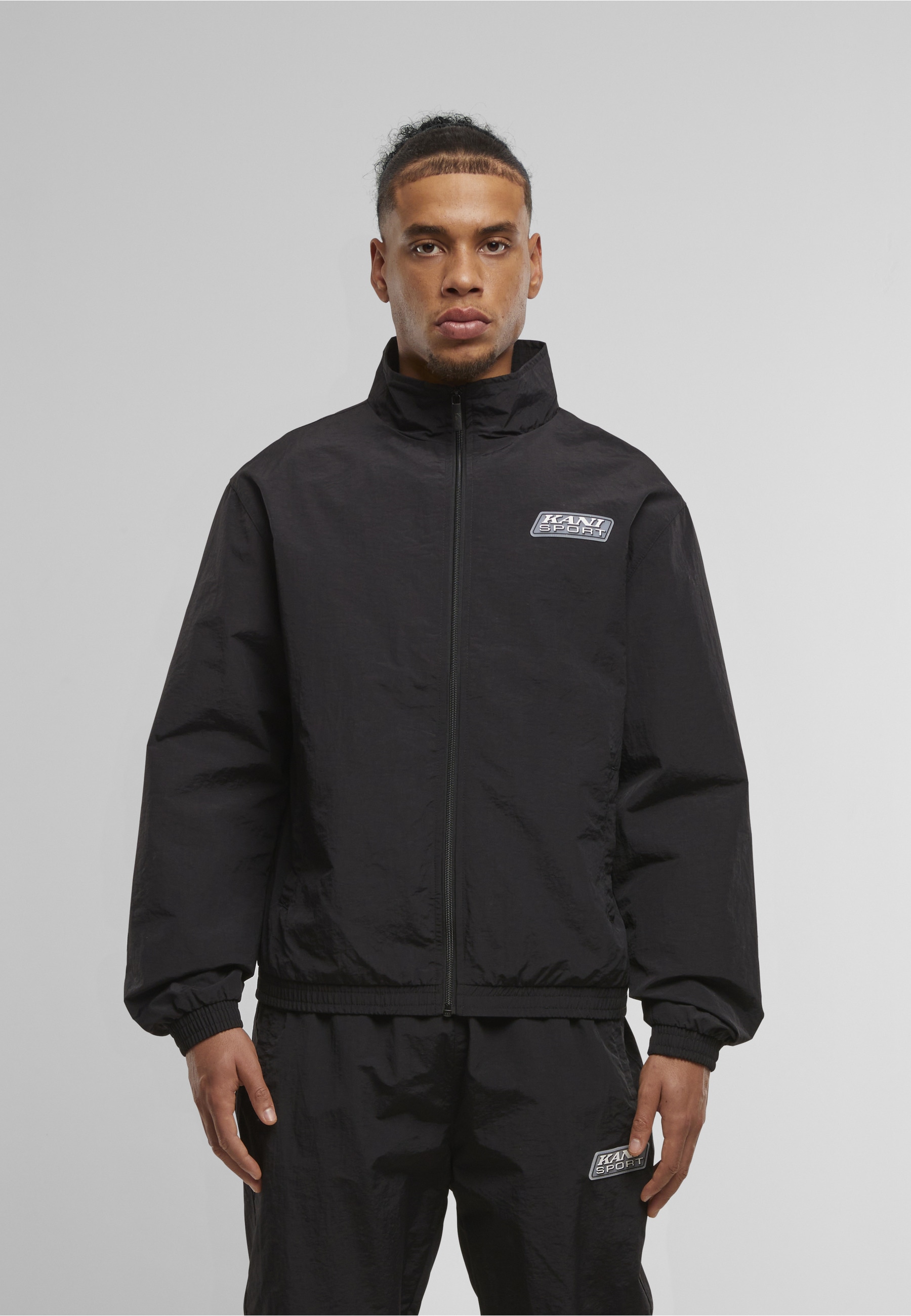 Karl Kani Trainingsjacke »Karl Kani Sport Patch Essential Trackjacket« 1 Stk. tlg. ohne Kapuze