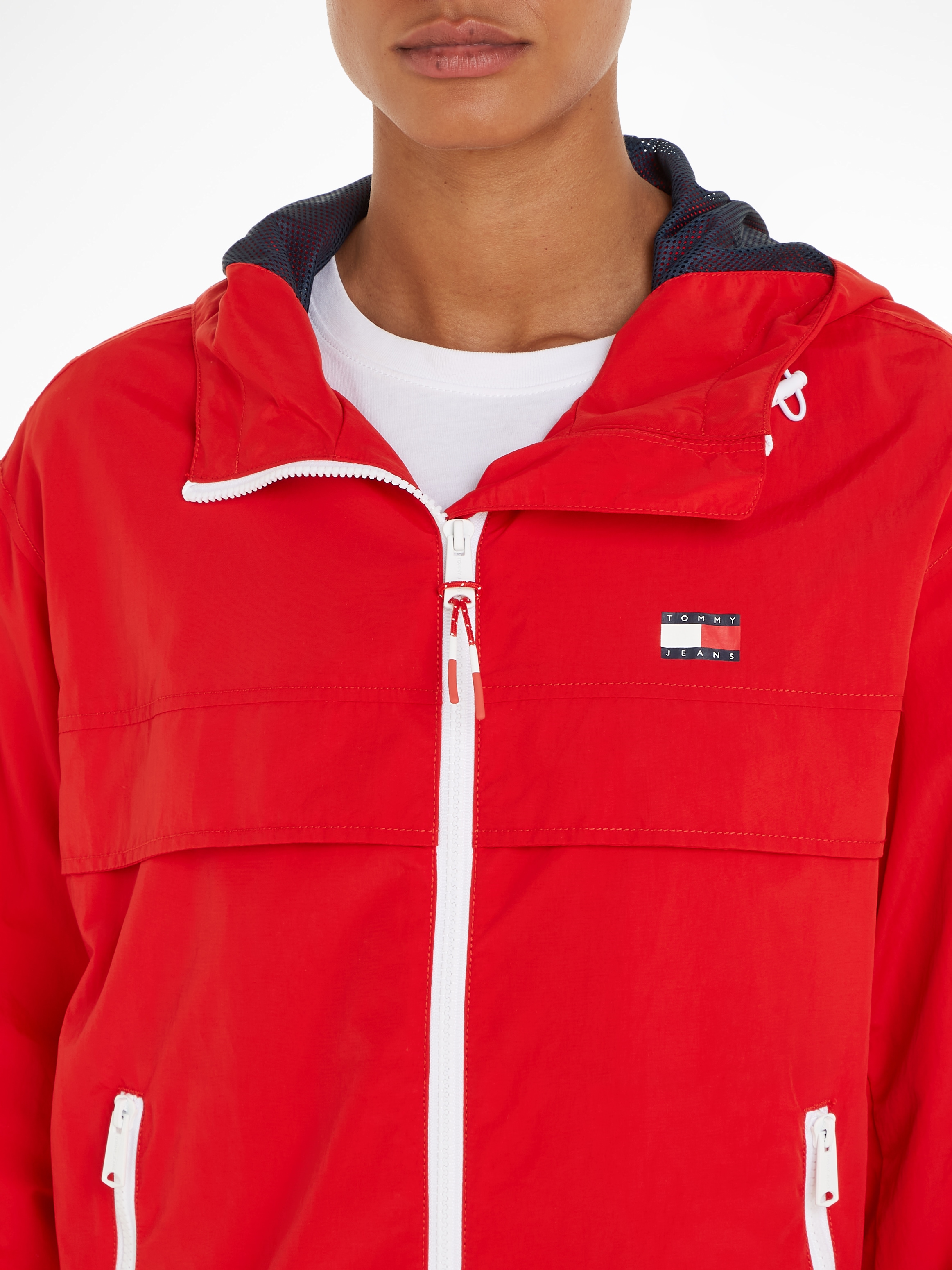 Tommy Jeans Windbreaker »TJW CHICAGO WINDBREAKER EXT«, mit Kapuze, mit kontrastfarbenen Reißverschlüssen